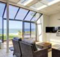 Whispering Sands 10 Sandy Point Road Luxury waterfront home with aircon WIFI  Foxtel - Sunshine Coast Guide